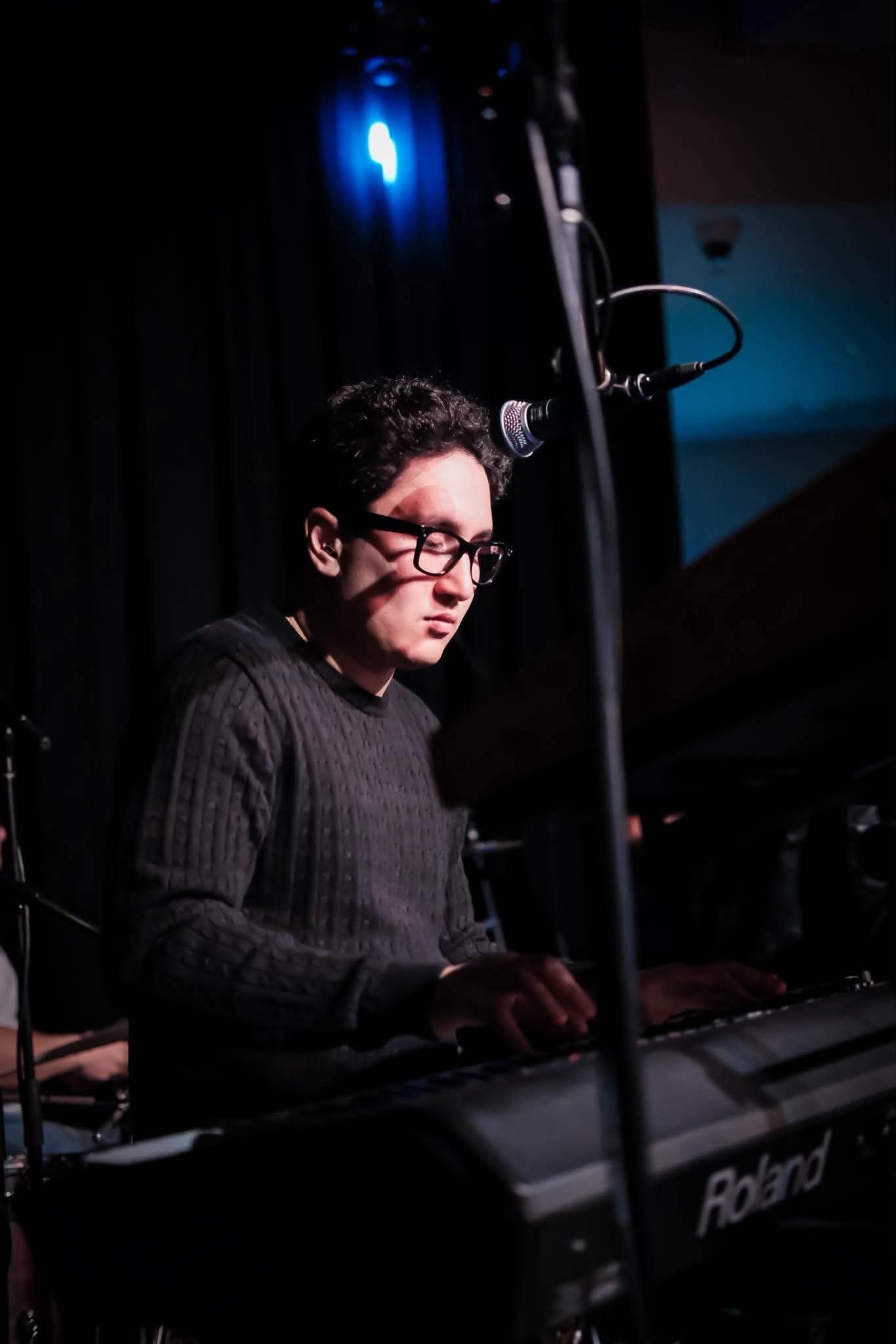 Claro accompanying a singer on stage